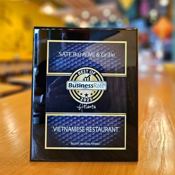 SATE Banh Mi & Grille's "Best of BusinessRate 2025 Atlanta Vietnamese Restaurant" award plaque.